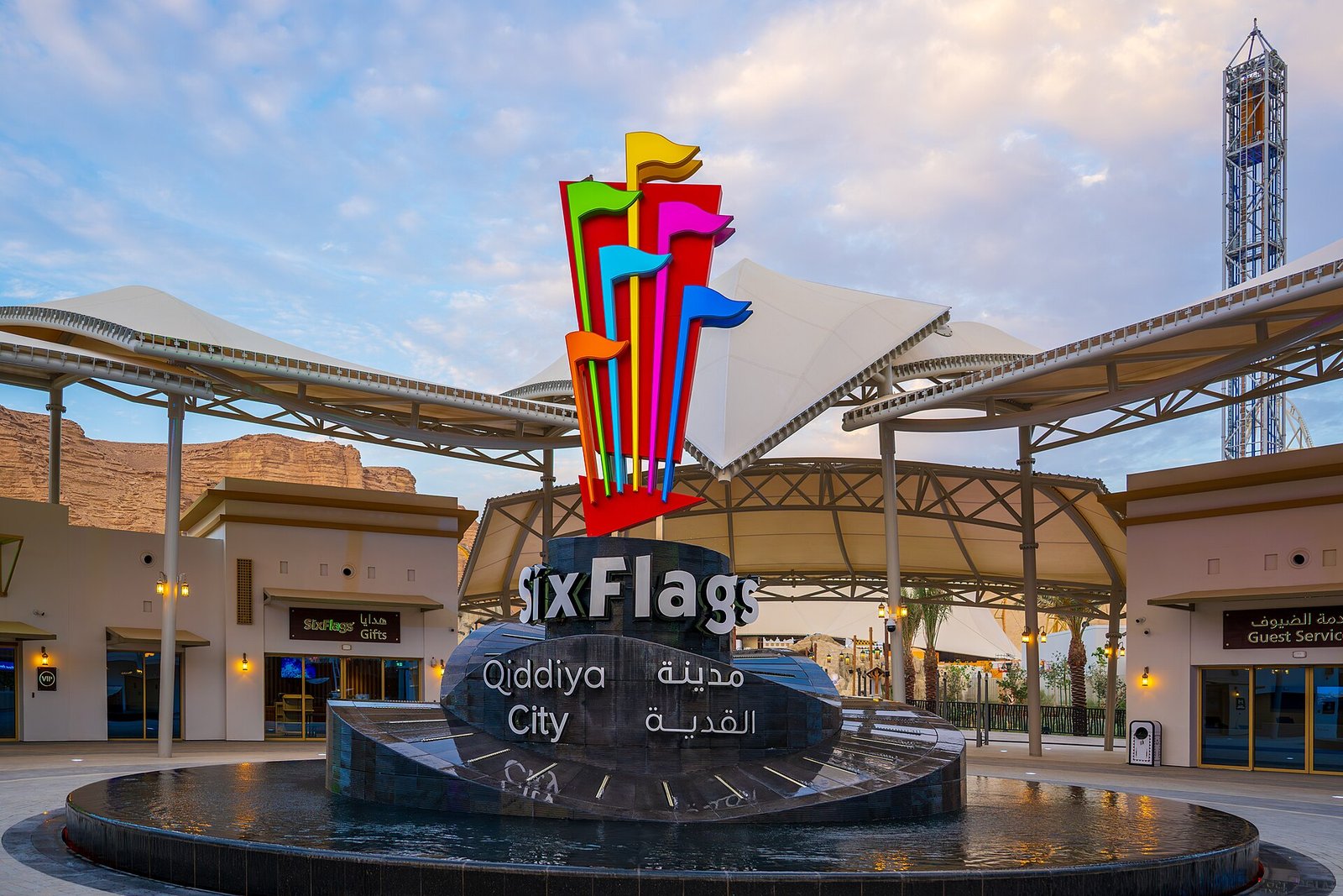 The colorful flag sculpture and fountain at the entrance plaza of Six Flags Qiddiya City, near Riyadh.