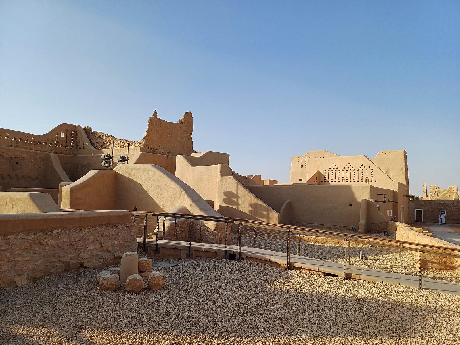The restored mud-brick palaces of At-Turaif in Diriyah, birthplace of the Saudi state, under a clear sky