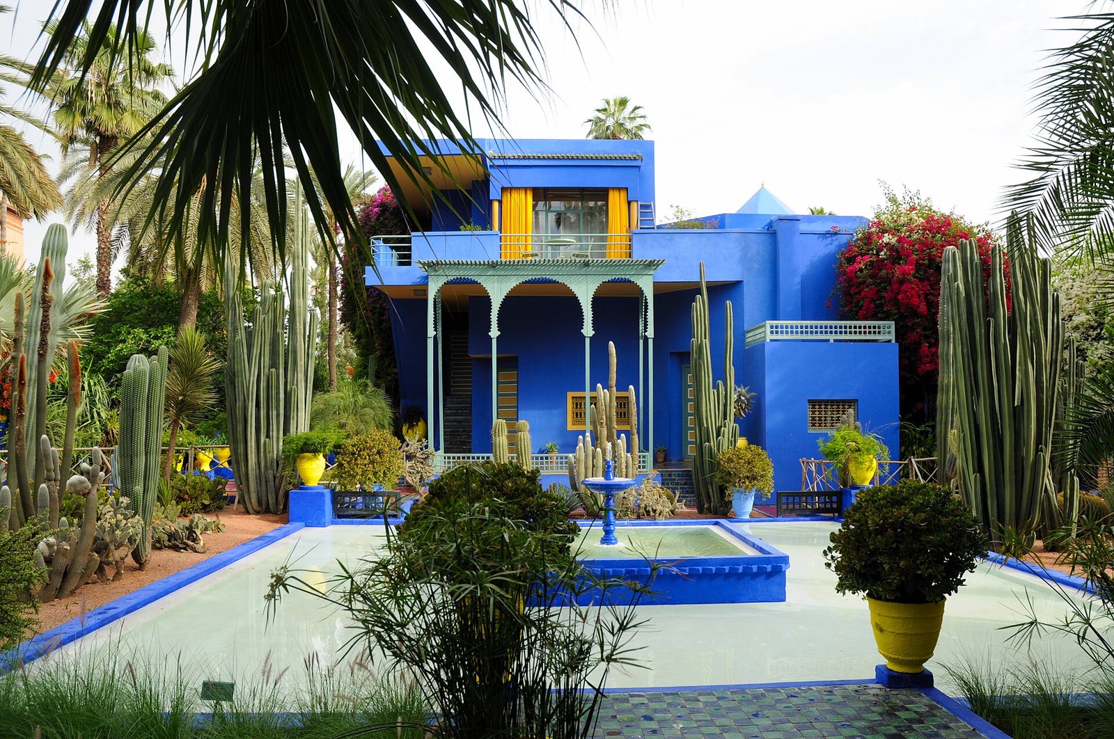 The cobalt-blue villa, cacti and fountain pool of the Jardin Majorelle in Marrakech