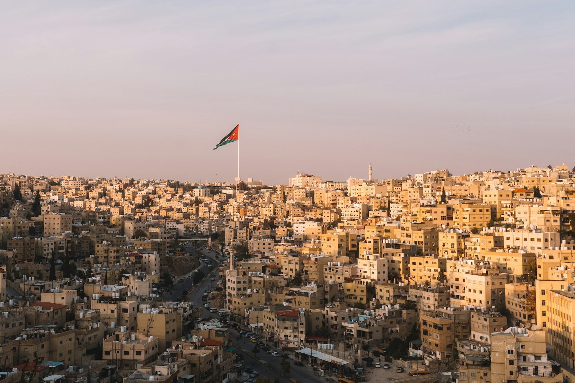Amman's hillside neighborhoods in golden evening light