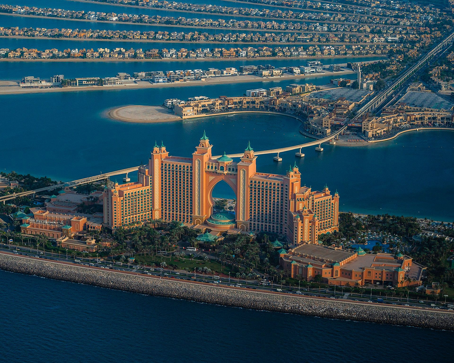 Atlantis The Palm seen from the air, with the villas and fronds of Palm Jumeirah behind