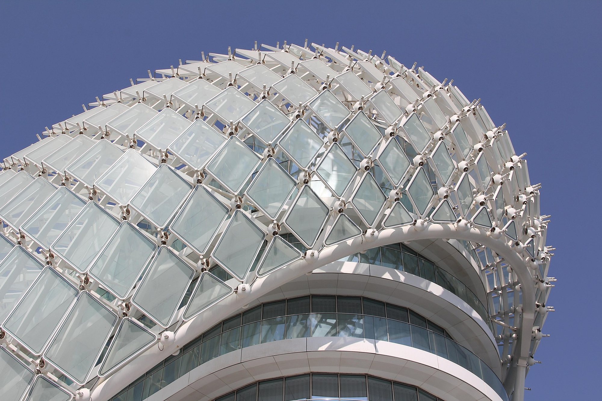 The glass grid shell of the W Abu Dhabi hotel above the Yas Marina Circuit