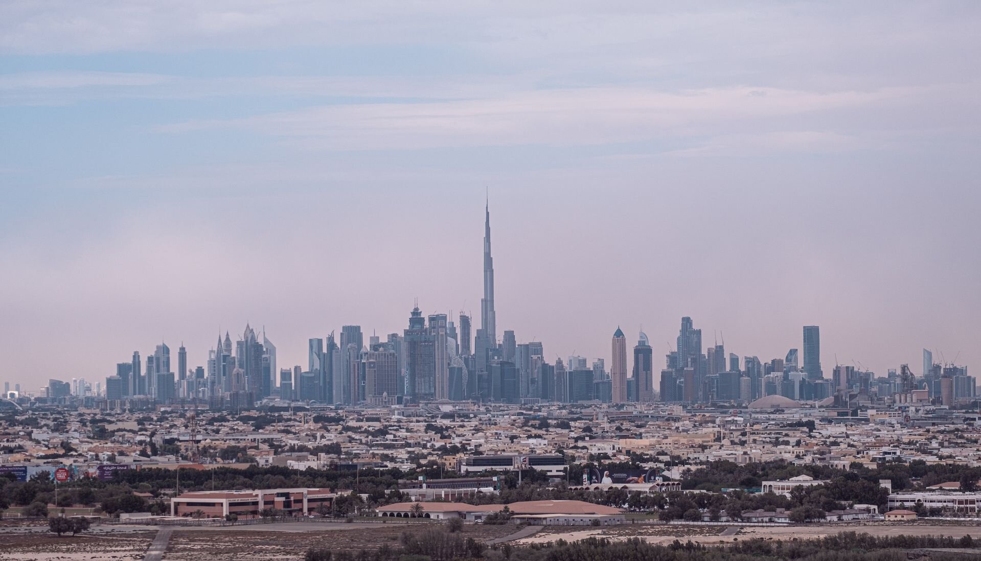 The Burj Khalifa and the skyline of Dubai rising above the city
