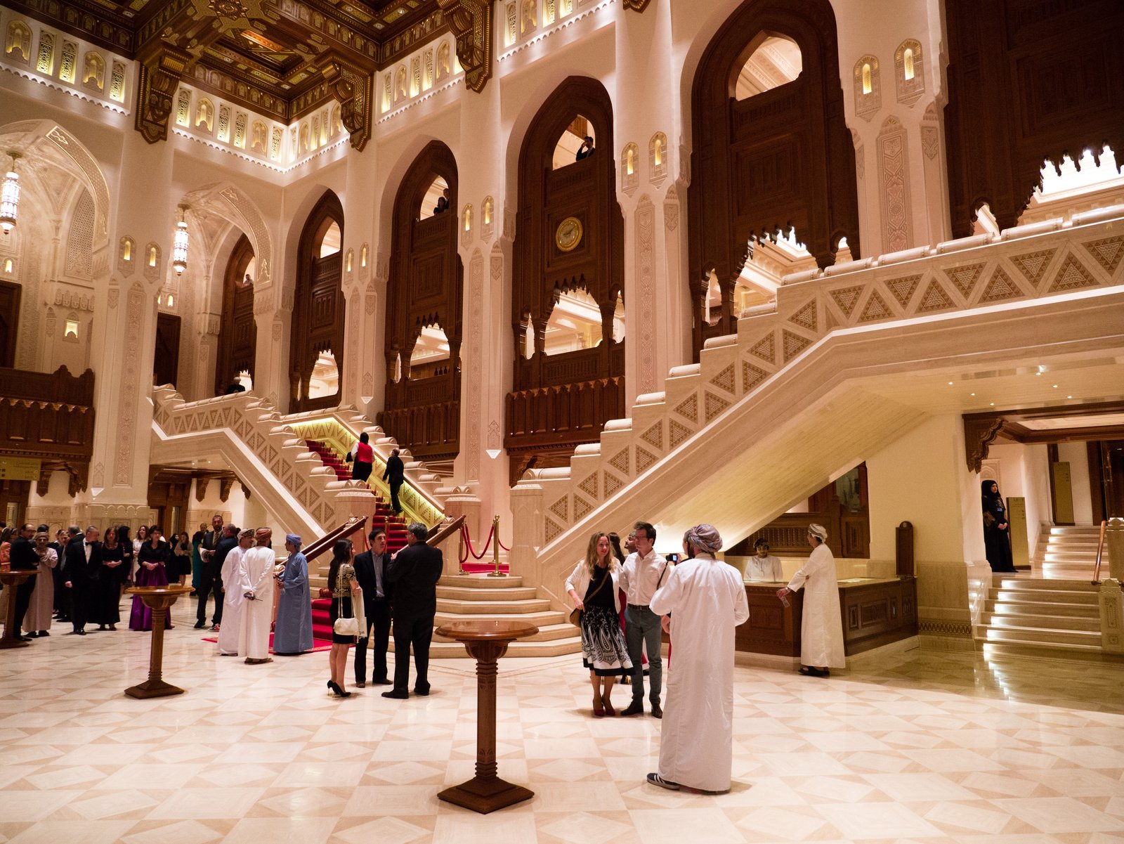 The grand marble foyer and sweeping staircases of the Royal Opera House Muscat.