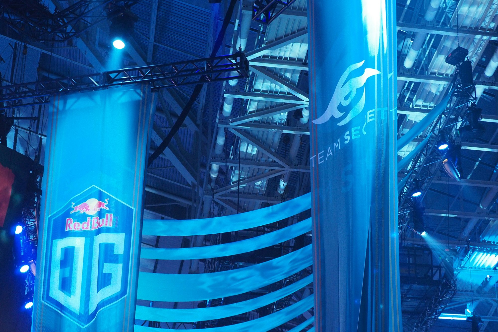 Team banners under the stage lights of a great esports arena