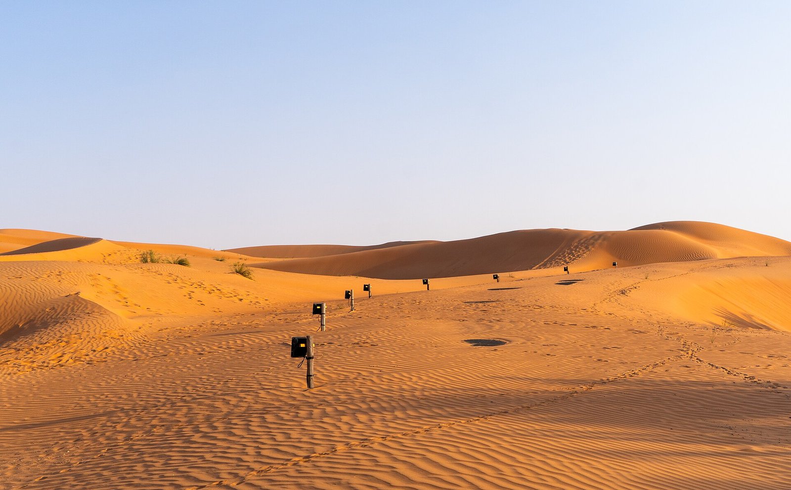 Wind-rippled golden dunes of the Liwa desert near the Qasr Al Sarab resort, Abu Dhabi.