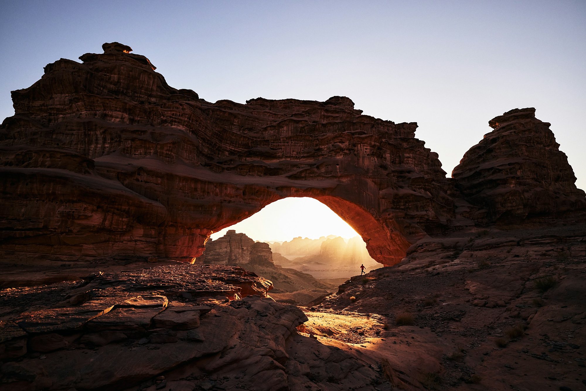 Sunlight through a great sandstone arch in the Hisma desert near Tabuk