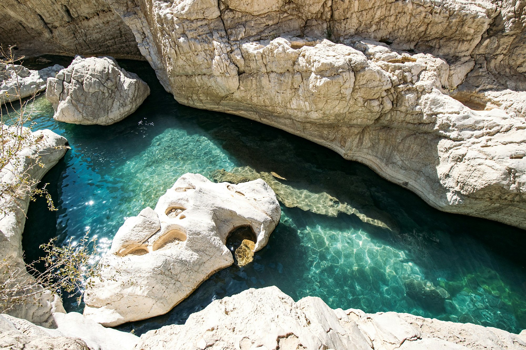 Turquoise water in a white rock wadi in Oman