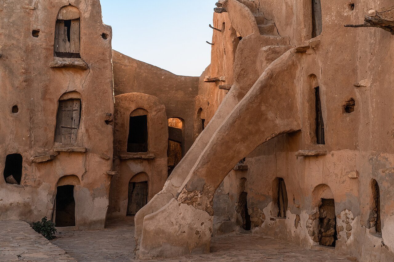 Stairways and vaulted granary rooms of Ksar Ouled Soltane in southern Tunisia, a Star Wars filming location, in warm late light.