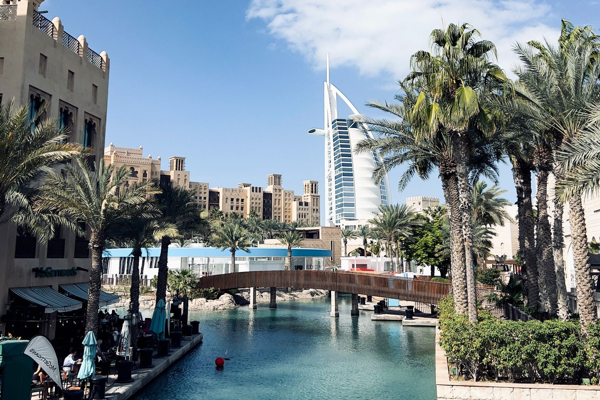 The Burj Al Arab above the palms and waterways of Madinat Jumeirah, Dubai
