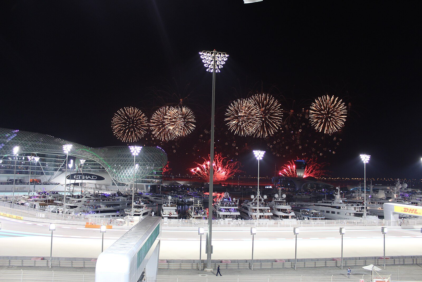 Fireworks bursting over Yas Marina Circuit and the yacht-lined marina at the Abu Dhabi Grand Prix.