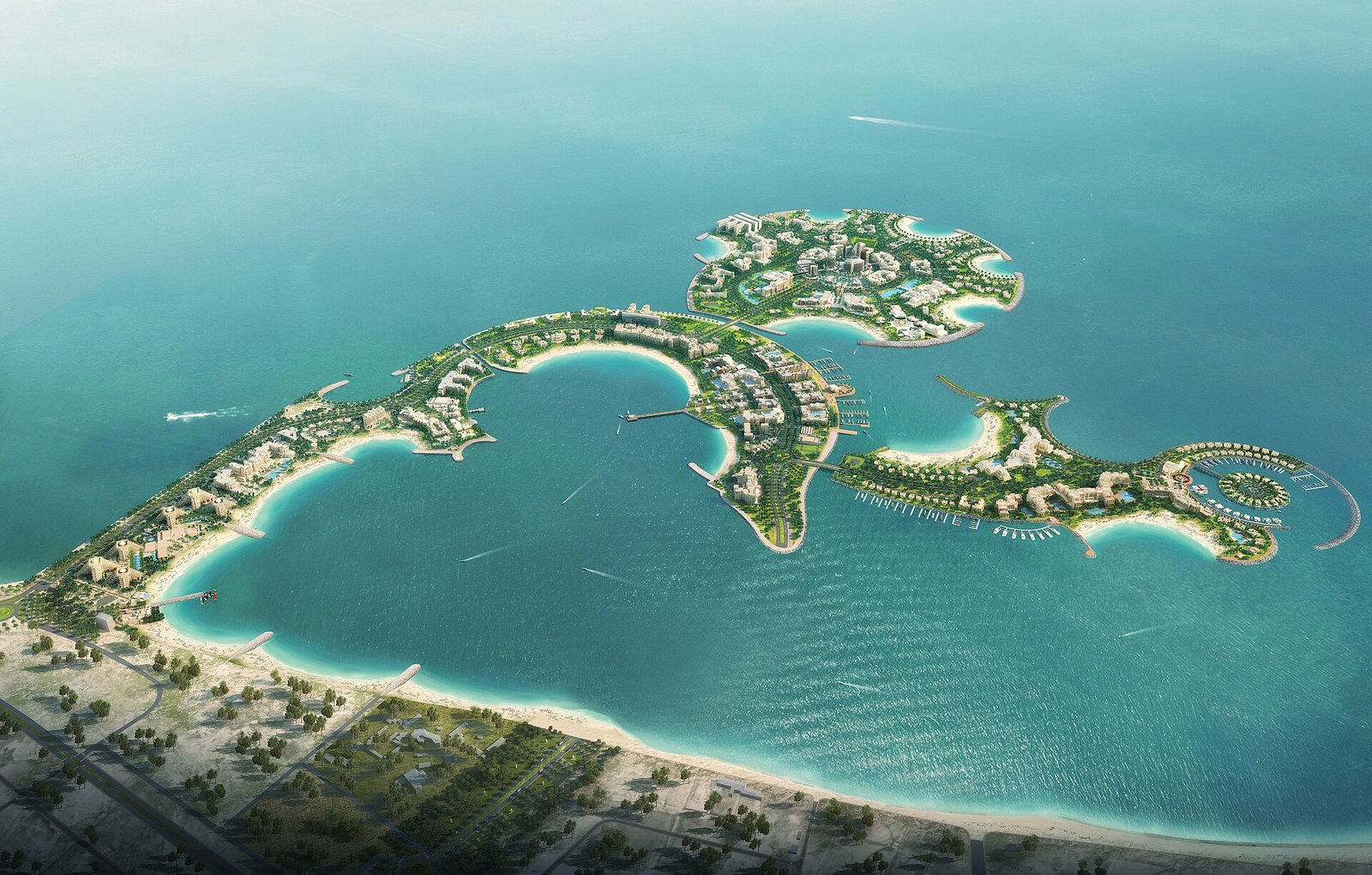 Al Marjan Island seen from the air, its four coral-shaped islands curving into the turquoise Arabian Gulf off Ras Al Khaimah.