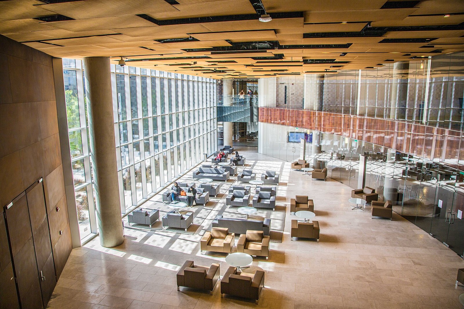 The sunlit glass atrium and lounge of Northwestern University in Qatar, Education City, Doha