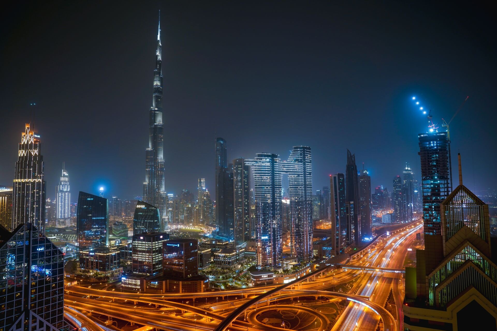 Burj Khalifa and Downtown Dubai at night above Sheikh Zayed Road