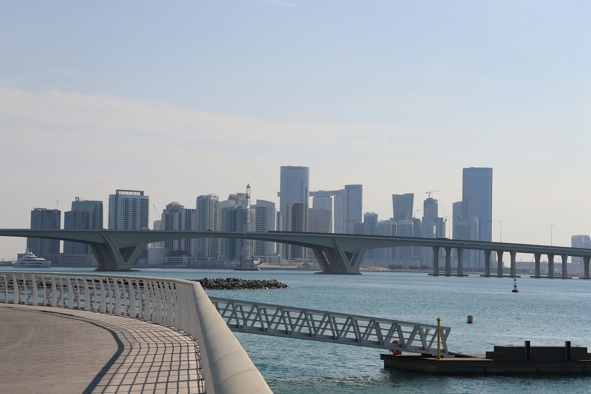 The towers of Al Reem Island beyond the Abu Dhabi bridges