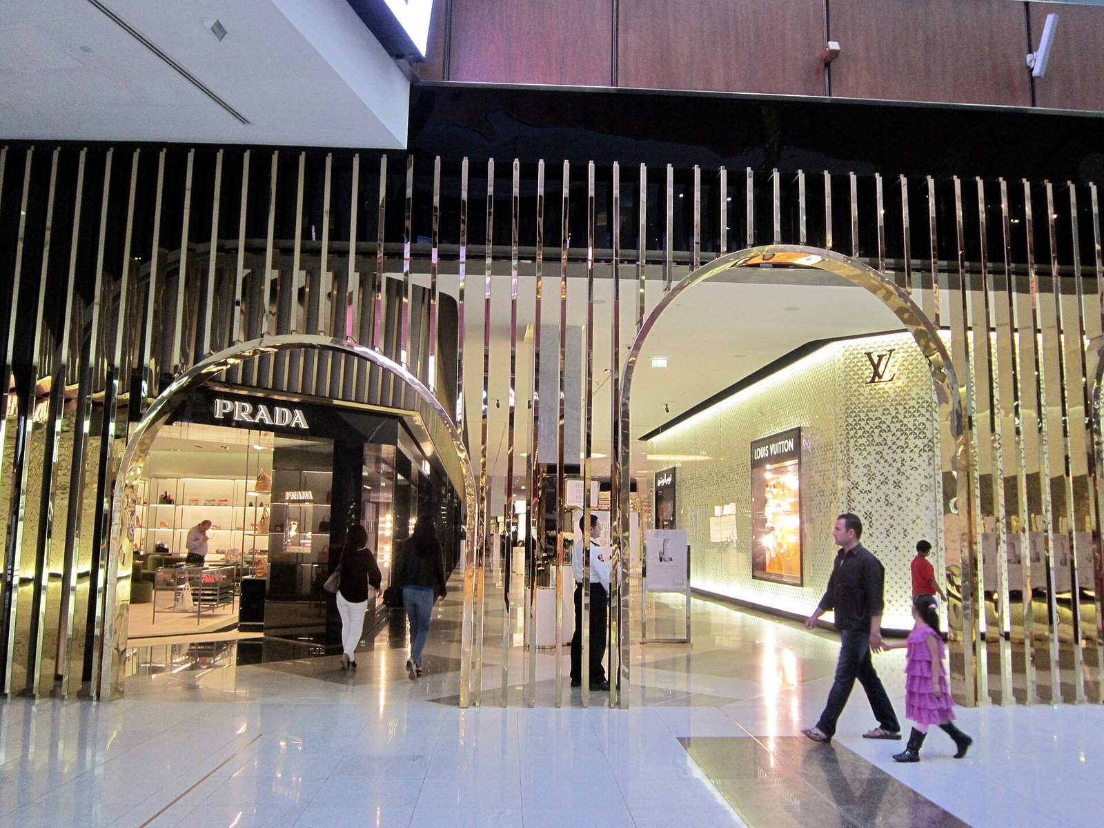 Marble walkways and illuminated designer boutiques inside the Dubai Mall's Fashion Avenue.