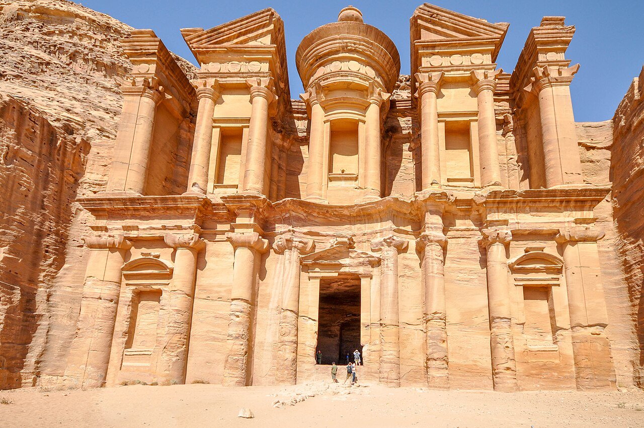 The monumental rock-cut facade of Ad Deir, the Monastery, high in the mountains of Petra.