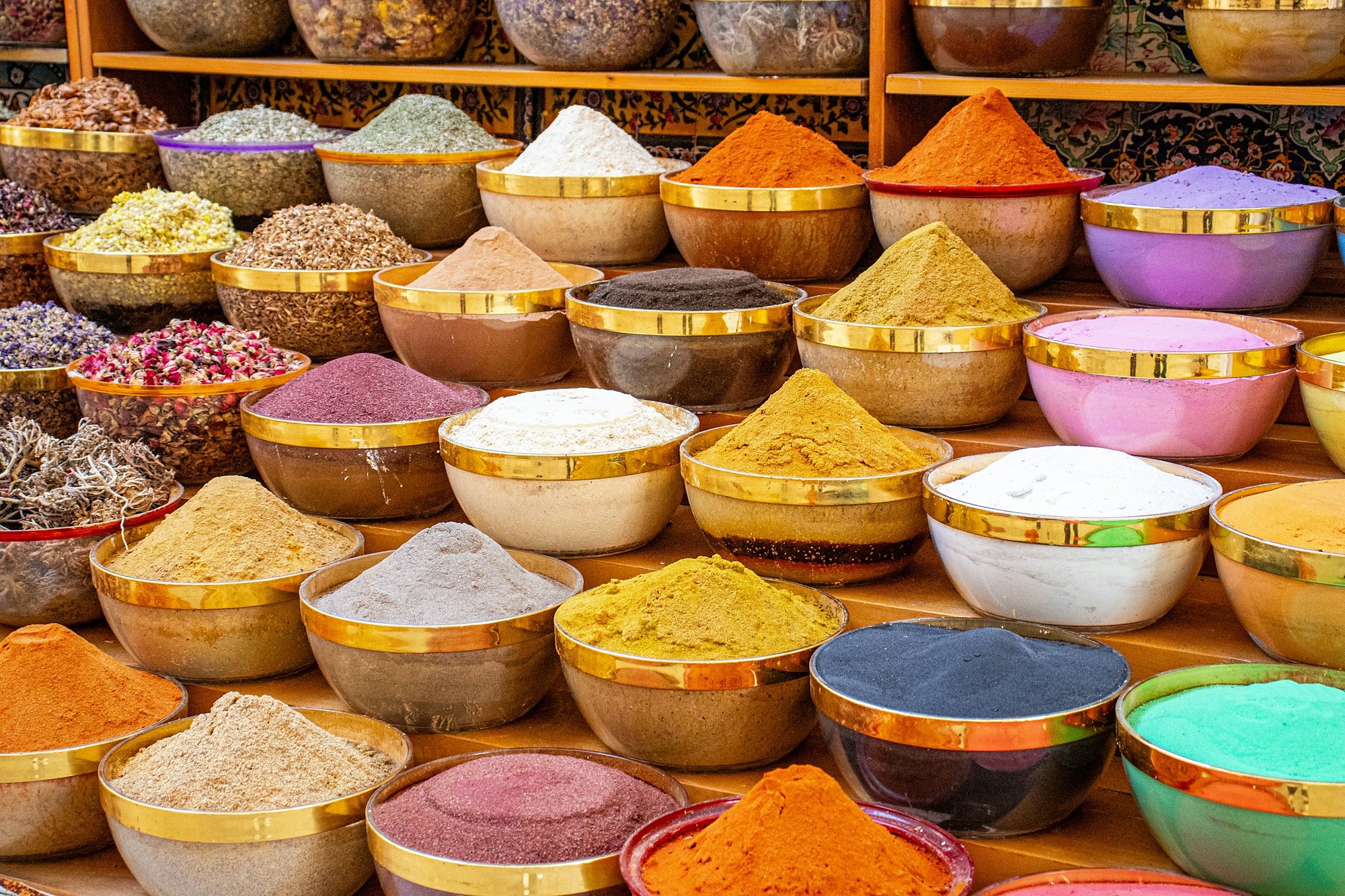 Bowls of spices and dried flowers in a souk