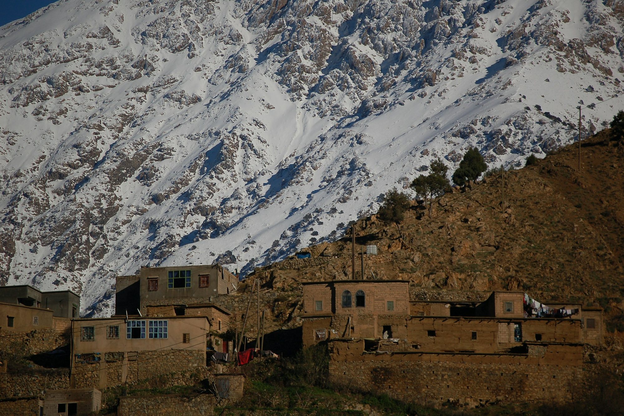 A Berber village below the snowy High Atlas, Morocco