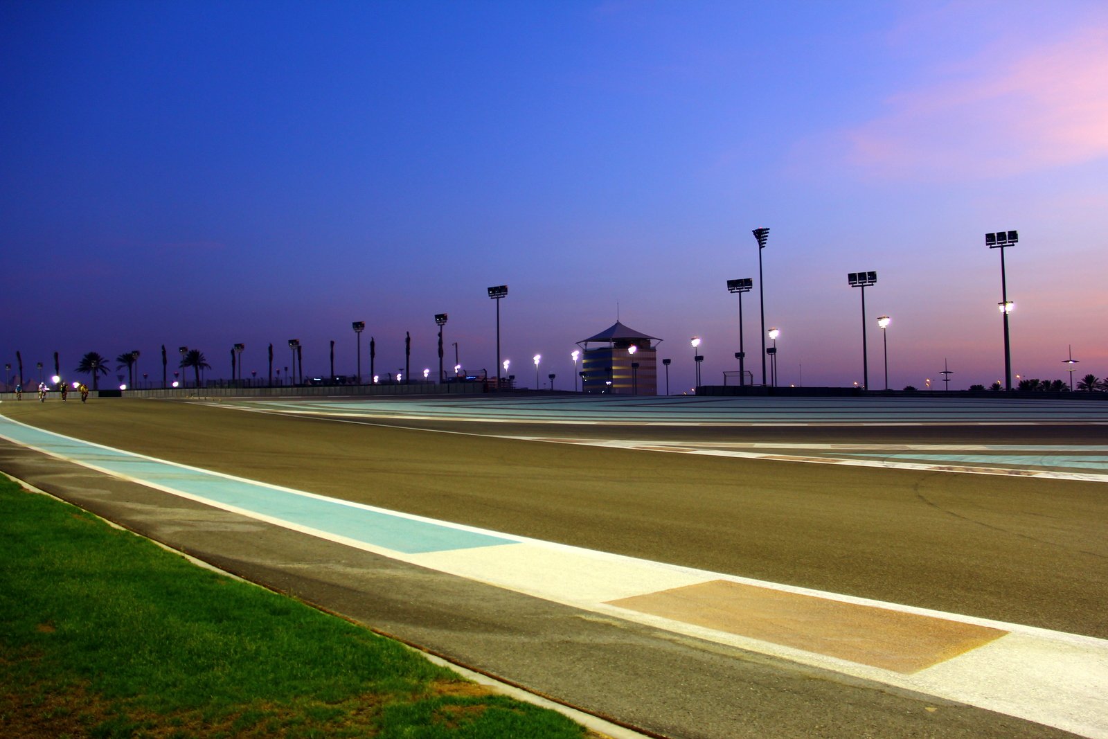 The track of the Yas Marina Circuit in Abu Dhabi beneath a violet sky at dusk.
