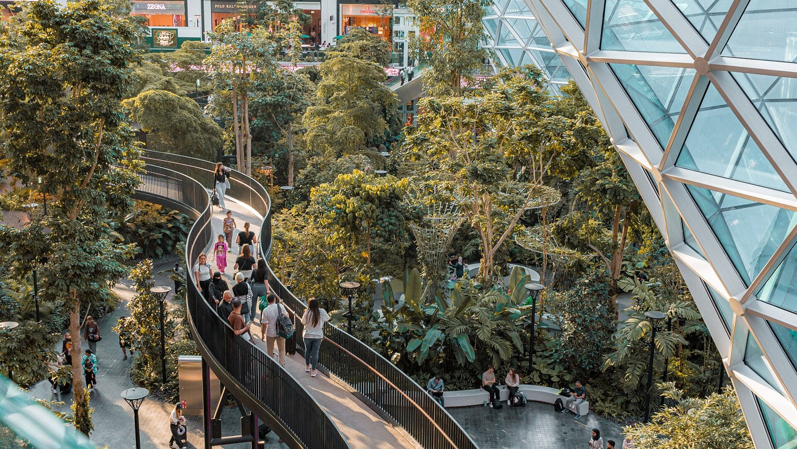 The Orchard, an indoor tropical garden with a winding walkway, in Hamad International Airport, Doha