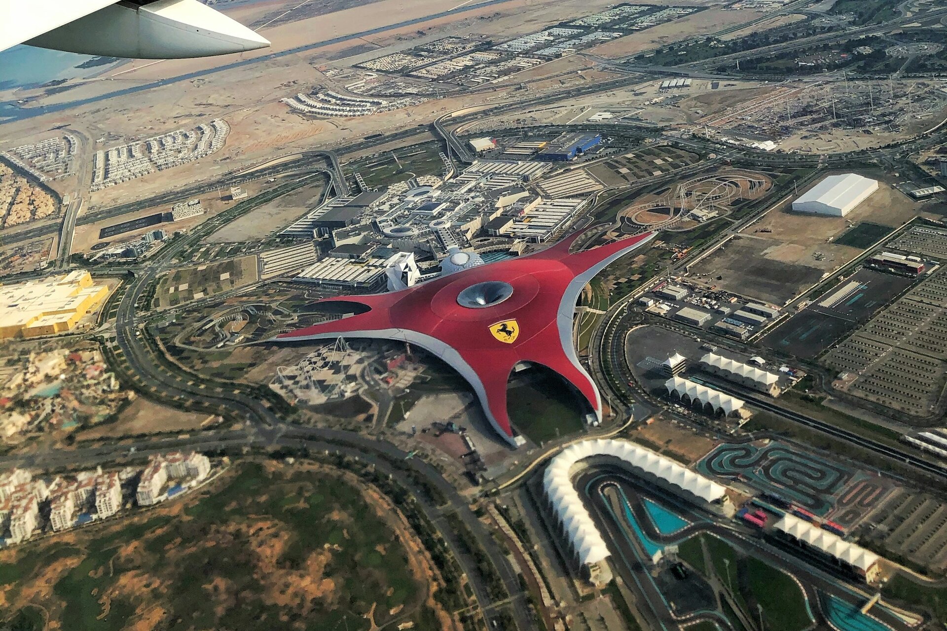 Ferrari World and the Yas Marina Circuit on Yas Island, Abu Dhabi, from an aircraft window
