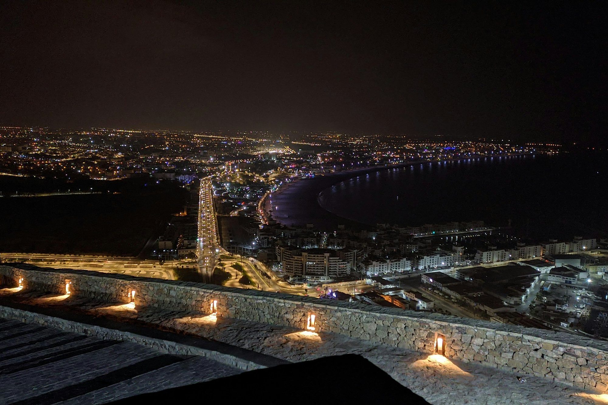 The lights of Agadir Bay at night from the Kasbah hill