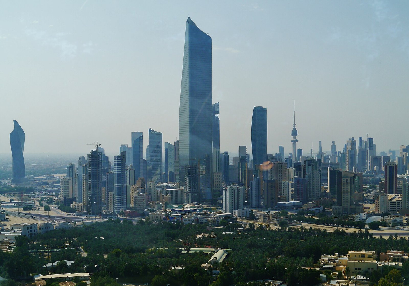 The sculpted Al Hamra Tower rises above the towers of Kuwait City, seen from the Kuwait Towers.