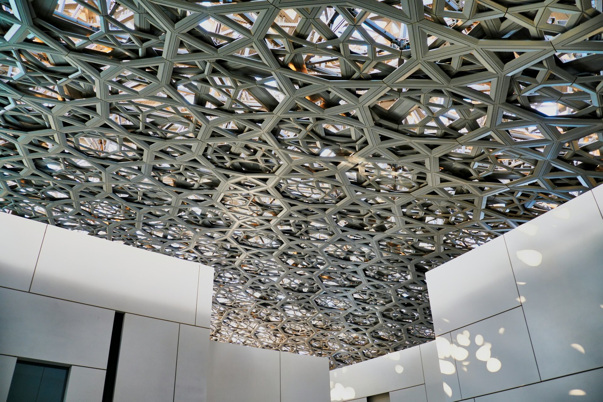 The lattice dome of the Louvre Abu Dhabi, filtering a rain of light, Saadiyat Island